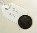 Currency coin - George III shilling (forgery), silver metal. Found dur…